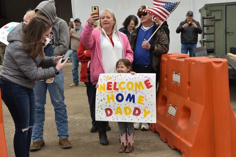 Families await the arrival of members of the 278th Armored Cavalry Regiment at Volunteer Training Site – Smyrna, Jan. 23, following the Soldiers’ 9-month deployment to Poland. This final wave of Soldiers represents the regiment’s completion of NATO’s enhanced Forward Presence (eFP) mission after 18 months by two separate squadrons. (U.S. Army photo by Staff Sgt. Tim Cordeiro)