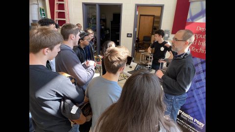 Austin Peay State University students show off robotic manufacturing systems and robots to Northeast High School students. (APSU)