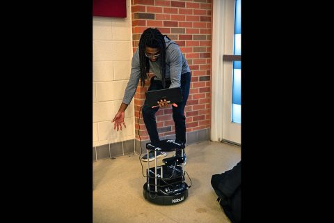 Austin Peay State University student Isaiah Carmichael tests the computer vision of a TurtleBot II. (APSU)