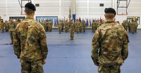 Lt. Col. Eric Anderson (left), commander, 129th Division Sustainment Support Battalion, 101st Airborne Division (Air Assault) Sustainment Brigade and Sgt. Maj. Jesse Oudenhaven (right), senior enlisted advisor, 129th Div. Sust. Support battalion, 101st Abn. Div. (Air Assault) Sust. Bde., stand before the battalion during a traditional ceremony held to un-case the battalion colors, Jan. 30, at Fort Campbell, KY. (Sgt. Aimee Nordin, 101st Airborne Division (AA) Sustainment Brigade Public Affairs)