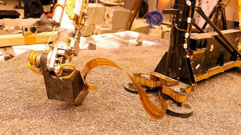 This test using an engineering model of the InSight lander here on Earth shows how the spacecraft on Mars will use its robotic arm to press on a digging device, called the "mole." (NASA/JPL-Caltech)