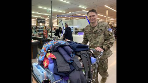 101st Airborne Division Sgt. Grant Ligon pays for donations intended for My House Battered Women’s Shelter in Ferizaj, Kosovo, January 26th, 2020. Ligon dedicated 10 euros per mile he completed during a ruck the day of his promotion ceremony, as a way to challenge himself physically and promote the Army value of selfless service. (Sgt. Patrick Kirby, 40th Public Affairs Detachment)