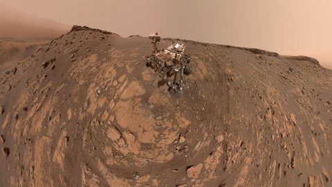 This selfie was taken by NASA's Curiosity Mars rover on Feb. 26, 2020 (the 2,687th Martian day, or sol, of the mission). The crumbling rock layer at the top of the image is "the Greenheugh Pediment," which Curiosity climbed soon after taking the image. (NASA/JPL-Caltech/MSSS)