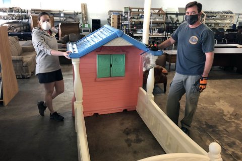 Volunteers Mary Jocelyn and Luke Dahlen help stage donated items for the Clarksville ReStore’s new online platform. The ReStore serves as the main revenue source for Habitat for Humanity of Montgomery County. Customers can now visit shopclarksvillerestore.org to shop for items sold at the nonprofit retailer. 