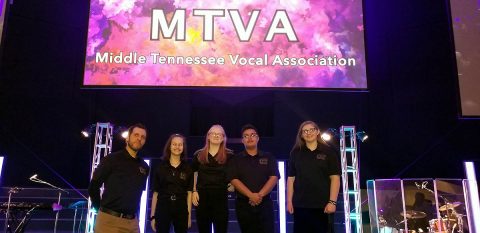 Kenwood Middle School Choir Director Robert Neumeyer, and choir students Samantha Strysick, Faith Graham, Jeavontae Clemons, and Blaize Durham.