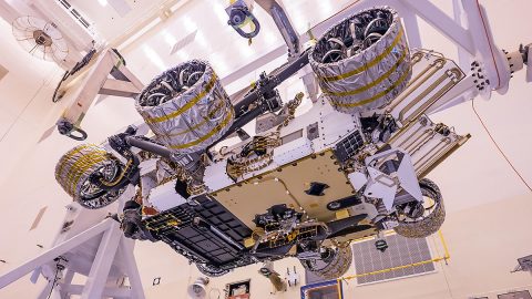 The Mars Helicopter, visible in lower center of the image, was attached to the belly of NASA's Perseverance rover at Kennedy Space Center on April 6, 2020. The helicopter will be deployed onto the Martian surface about two-and-a-half months after Perseverance lands. (NASA/JPL-Caltech) The Mars Helicopter, visible in lower center of the image, was attached to the belly of NASA's Perseverance rover at Kennedy Space Center on April 6, 2020. The helicopter will be deployed onto the Martian surface about two-and-a-half months after Perseverance lands. (NASA/JPL-Caltech)