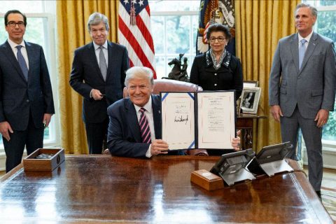 President Donald Trump signs H.R. 266, the Paycheck Protection Program and Health Care Enhancement Act. (White House)