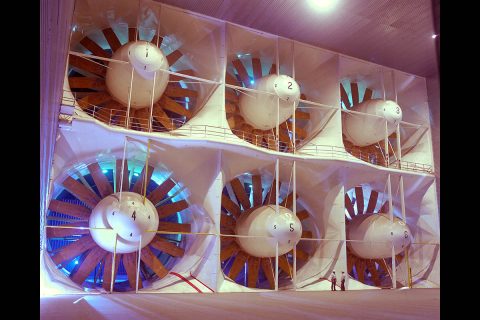 This system of fans moves air through the world’s largest wind tunnels, at the National Full-Scale Aerodynamics Complex at NASA’s Ames Research Center in California’s Silicon Valley. Each of the six fans is 40 feet in diameter and is driven by a 22,500-horsepower electric motor. Two figures near fan 5 give a sense of scale. (NASA/Ames Research Center/Tom Trower)