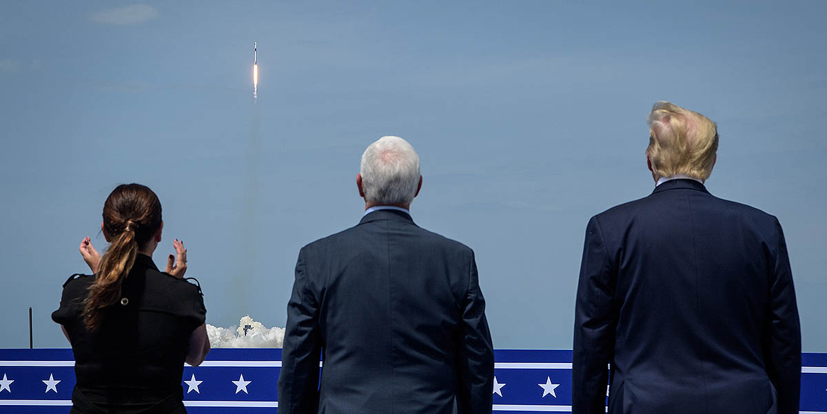 President Donald Trump, right, Vice President Mike Pence, and Second Lady Karen Pence watch the launch of a SpaceX Falcon 9 rocket carrying the company’s Crew Dragon spacecraft on NASA’s SpaceX Demo-2 mission with NASA astronauts Robert Behnken and Douglas Hurley onboard, Saturday, May 30, 2020, from the balcony of Operations Support Building II at NASA’s Kennedy Space Center in Florida. (NASA/Bill Ingalls)