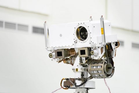 A close-up of the head of Perseverance Rover's remote sensing mast. The mast head contains the SuperCam instrument (its lens is in the large circular opening). In the gray boxes beneath mast head are the two Mastcam-Z imagers. On the exterior sides of those imagers are the rover's two navigation cameras. (NASA/JPL-Caltech)