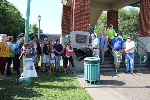 Ericka Prosecky, Clarksville Street Department Director David Shepard and Mayor Joe Pitts unveiled Monday a plaque to honor the memory of Jeffrey Prosecky Jr.