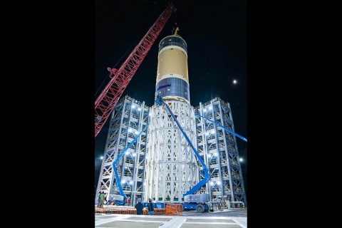 The liquid oxygen tank structural test article, shown here, for NASA’s Space Launch System (SLS) rocket’s core stage was the last test article loaded into the test stand July 10, 2019. The liquid oxygen tank is one of two propellant tanks in the rocket’s massive core stage that will produce more than 2 million pounds of thrust to help launch Artemis I, the first flight of SLS and NASA’s Orion spacecraft to the Moon.(NASA/Tyler Martin)