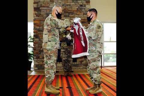 Fort Campbell Soldier Recovery Unit leaders, (from left) Command Sgt. Maj. Angel Rivera and Lt. Col. Heath Holt uncase the SRU colors. The Fort Campbell Warrior Transition Battalion was formally reflagged as the Fort Campbell Soldier Recovery Unit during a reflagging ceremony on Fort Campbell, July 10th. (U.S. Army)