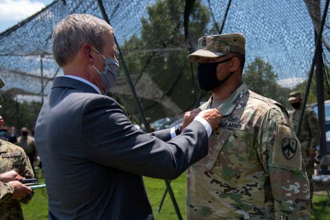 Gov. Bill Lee presents the Soldier’s Medal to Sgt. 1st Class Patrick Shields, a member of the Tennessee National Guard’s Detachment 1, 1175th Transportation Company, in Brownsville on July 10. Shields stopped, disarmed and restrained a gunman after shots were fired in a parking lot following a high school football game in October 2018. (Staff Sgt. Timothy Cordeiro)