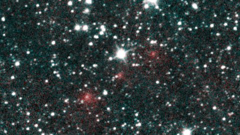 Comet C/2020 F3 NEOWISE appears as a string of fuzzy red dots in this composite of several heat-sensitive infrared images taken by NASA's Near-Earth Object Wide-field Infrared Survey Explorer (NEOWISE) mission on March 27, 2020. (NASA/JPL-Caltech)