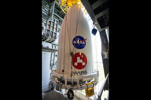 The nose cone containing NASA's Mars 2020 Perseverance rover is maneuvered into place atop its Atlas V rocket. The image was taken at Cape Canaveral Air Force Station in Florida on July 7, 2020. (NASA/KSC)