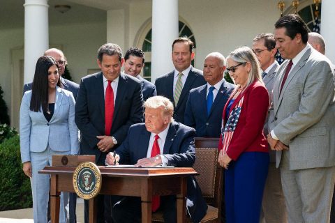 President Donald Trump signs an executive order on the Hispanic Prosperity Initiative. (Whtie House)