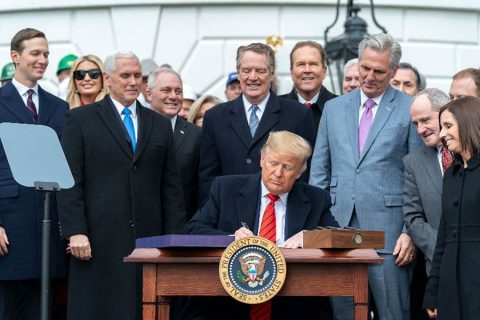 President Donald Trump signs the United States-Mexico-Canada Trade Agreement. (White House)