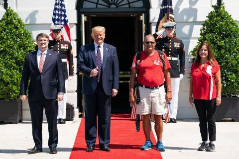 President Donald Trump, Veterans Affairs Secretary Robert Wilkie, and Second Lady Karen Pence with U.S. Marine Terry Sharpe, the “Walking Marine”. (White House)