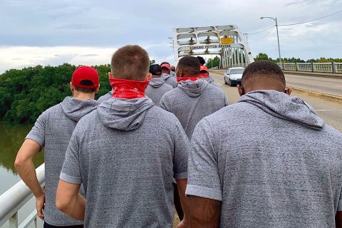 Austin Peay State University football players approach the bridge. (APSU)