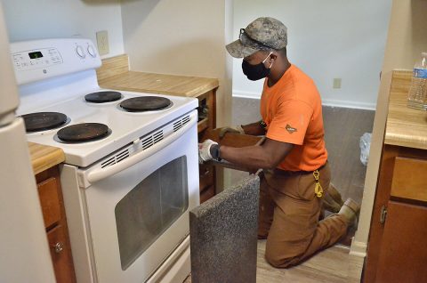 Brandon Barfield, Campbell Crossing-Lendlease maintenance worker, prepares to install kitchen counters in a home in Pierce Village before new residents move in. U.S. Army Garrison-Fort Campbell in partnership with Campbell Crossing-Lendlease has developed a plan for major home construction and renovation in the next five years as part of the long-term goal to replace legacy housing with quality homes for Soldiers and Families assigned to Fort Campbell. (Emily LaForme, Fort Campbell Courier)