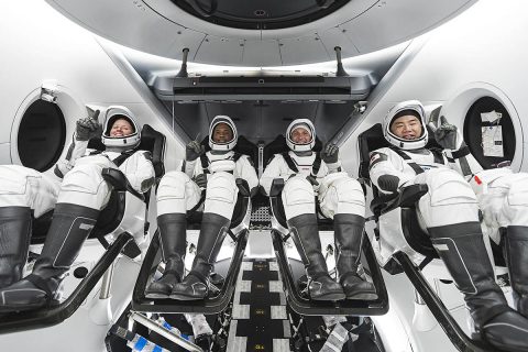 NASA’s SpaceX Crew-1 crew members are seen seated in the company’s Crew Dragon spacecraft during crew equipment interface training. From left to right are NASA astronauts Shannon Walker, mission specialist; Victor Glover, pilot; and Mike Hopkins, Crew Dragon commander; and JAXA astronaut Soichi Noguchi, mission specialist. (SpaceX)