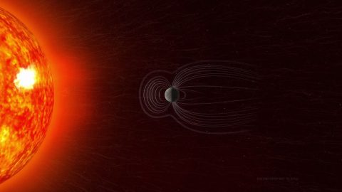 The Sun expels a constant outflow of particles and magnetic fields known as the solar wind and vast clouds of hot plasma and radiation called coronal mass ejections. This solar material streams across space and strikes Earth’s magnetosphere, the space occupied by Earth’s magnetic field, which acts like a protective shield around the planet. (NASA Goddard / Bailee DesRocher)