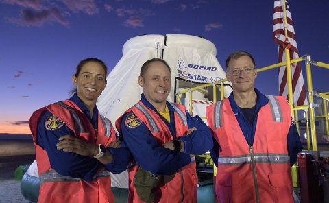 NASA astronauts Nicole Mann, left, Mike Fincke, and Boeing astronaut Chris Ferguson, right, pose for a photograph on Sept. 11, 2019, as they, along with teams from NASA, Boeing and the White Sands Missile Range, rehearse landing and crew extraction from Boeing’s CST-100 Starliner. (Boeing)