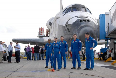 STS-120 Commander Pamela Melroy talked to media and guests on the Shuttle Landing Facility at NASA's Kennedy Space Center after landing Space Shuttle Discovery. Behind her from left are mission specialist Stephanie Wilson, pilot George Zamka and mission specialists Doug Wheelock and Scott Parazynski. Mission STS-120 continued the construction of the station with the installation of the Harmony Node 2 module and the relocation of the P6 truss. (Kim Shiflett)