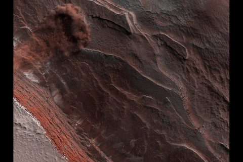 The High-Resolution Imaging Science Experiment (Hi-RISE) camera aboard NASA's Mars Reconnaissance Orbiter captured this avalanche plunging down a 1,640-foot-tall (500-meter-tall) cliff on May 29, 2019. The image also reveals layers at Mars' north pole during spring. As temperatures increase and vaporize ice, the destabilized ice blocks break loose and kick up dust. (NASA/JPL-Caltech/University of Arizona)