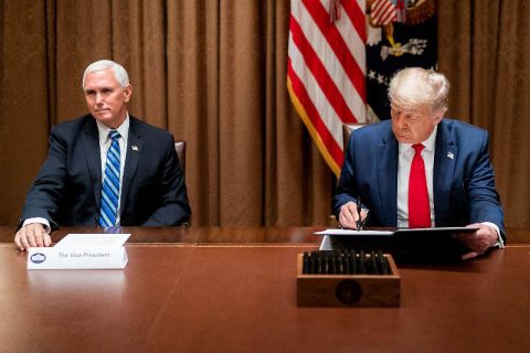 President Donald Trump, joined by Vice President Mike Pence, signs an Executive Order on Hiring American. (White House)