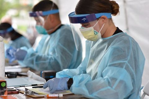 Pfc. Kathryn Ratliff works at the COVID-19 testing site in Downtown Nashville.  (Staff Sgt. Timothy Cordeiro)