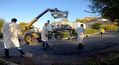 Technicians move an engineering version of the Perseverance Mars rover into to its new home in the Mars Yard, part of NASA's Jet Propulsion Laboratory in Southern California. (NASA/JPL-Caltech)