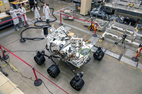 Engineers test drive the Earth-bound twin of NASA's Perseverance Mars rover for the first time in a warehouselike assembly room at the agency's Jet Propulsion Laboratory in Southern California. (NASA/JPL-Caltech)