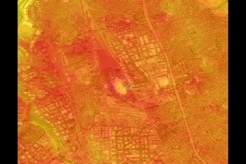 This image shows the ECOSTRESS land surface temperature variations measured on May 22, 2020, during the full lockdown period over an area centered on the Great Mall in Milpitas. The blue dots represent ground truth measurements on May 22 in large vacant parking lots. The darkish reddish shades show the highest temperatures on dark asphalt parking lots and roadways, and the yellow-greenish shades indicate lower temperatures in parklands and semi-vegetated areas. Bright white rooftops are in the middle shades. (Christopher Potter, NASA Ames Research Center)