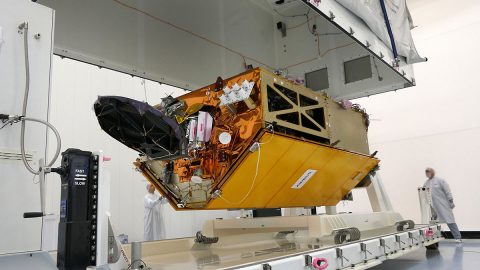 The Sentinel-6 Michael Freilich spacecraft undergoes tests at its manufacturer Airbus in Friedrichshafen, Germany, in 2019. The white GNSS-RO instrument can be seen attached to the upper left portion of the front of the spacecraft. (Airbus) The Sentinel-6 Michael Freilich spacecraft undergoes tests at its manufacturer Airbus in Friedrichshafen, Germany, in 2019. The white GNSS-RO instrument can be seen attached to the upper left portion of the front of the spacecraft. (Airbus)