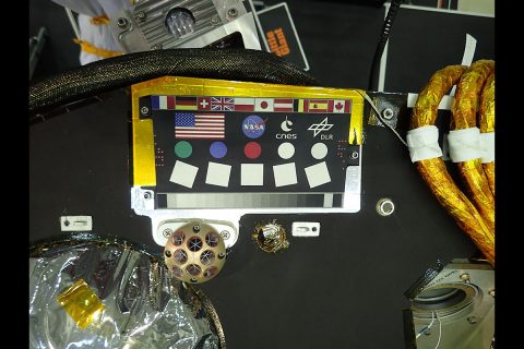 Laser Retroreflector for InSight (LaRRI) is the copper-colored half-dome on the deck of NASA's InSight lander. This image shows LaRRI's location below InSight's calibration target. (NASA/JPL-Caltech) Laser Retroreflector for InSight (LaRRI) is the copper-colored half-dome on the deck of NASA's InSight lander. This image shows LaRRI's location below InSight's calibration target. (NASA/JPL-Caltech)