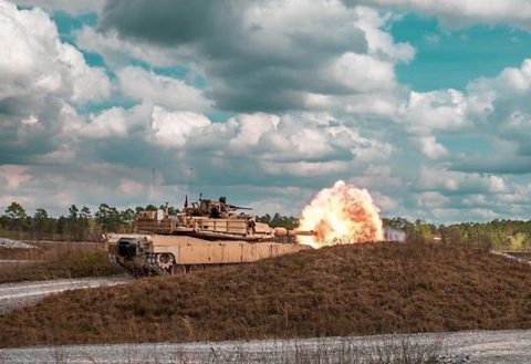 Tank crews assigned to the 278th Armored Cavalry Regiment fires the main cannon of an M1 Abrams tank during tank gunnery at Camp Shelby, Mississippi. (Sgt. Art Guzman)