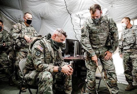 Maj. Gen. Jeff Holmes, Tennessee’s Adjutant General, receives an operations briefing from Maj. Brian Tomberlin, the 278th Armored Cavalry Regiment’s Operations Officer, at the 278th’s Command Post during Annual Training at Tullahoma’s Volunteer Training Site on Aug. 16. (Sgt. Art Guzman)