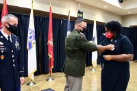 Clemmer bumps elbows with Austin Peay State University Interim President Dannelle Whiteside. (APSU)