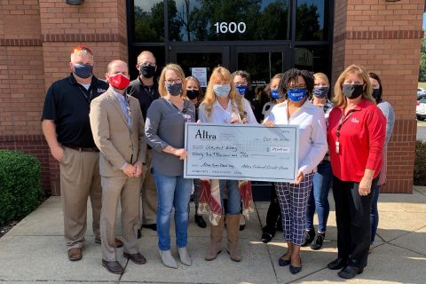 Altra employees: Rose Melton, Jesse Presley, Gail Fielder, Dan Schwaab, Brian Selph, Heather Cheesman. Valerie Guzman, Stephanie Knight, and Brandi Ficklin from United Way of Greater Clarksville with Leslie Chiodini from Community Action Agency and Terri Williams from Crisis 211.