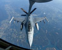 Dignitaries with the Bulgarian Armed Forces observe an in-flight a refueling, Oct. 7, while onboard a KC-135 Stratomaker aircraft assigned to the 134th Air Refueling Wing, based in Knoxville. The Bulgarian officials were on their way to Tennessee to spend time with the Tennessee National Guard, after signing a new training roadmap, renewing their partnership with the United States through 2030. (Staff Sgt. Timothy Cordeiro, Tennessee National Guard Public Affairs Office)