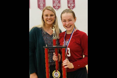 Clarksville Christian School middle school volleyball Coach Madison Poen with Tournament MVP Sylas Bryant.