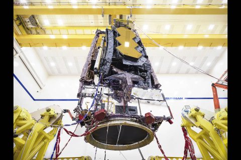 For the first time ever, testing teams at Northrop Grumman in Redondo Beach, California carefully lifted the fully assembled James Webb Space Telescope in order to prepare it for transport to nearby acoustic and sine-vibration testing facilities. (NASA/Chris Gunn) For the first time ever, testing teams at Northrop Grumman in Redondo Beach, California carefully lifted the fully assembled James Webb Space Telescope in order to prepare it for transport to nearby acoustic and sine-vibration testing facilities. (NASA/Chris Gunn)