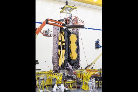 For the first time ever, testing teams at Northrop Grumman in Redondo Beach, California carefully lifted the fully assembled James Webb Space Telescope in order to prepare it for transport to nearby acoustic and sine-vibration testing facilities. (NASA/Chris Gunn) For the first time ever, testing teams at Northrop Grumman in Redondo Beach, California carefully lifted the fully assembled James Webb Space Telescope in order to prepare it for transport to nearby acoustic and sine-vibration testing facilities. (NASA/Chris Gunn)