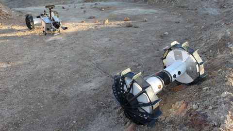 During the same field test, the DuAxel rover separates into two single-axled robots so that one can rappel down a slope too steep for conventional rovers. (NASA/JPL-Caltech/J.D. Gammell)