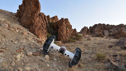 The two-wheeled Axel descends the slope while tethered to its counterpart anchored above the slope. The tether serves as a climbing rope of sorts while also providing power and a means of communication. (NASA/JPL-Caltech/J.D. Gammell)