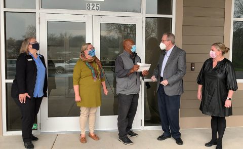 Ross Hicks (FPC Bicentennial Committee Chair), and Maggie McGrady-Sumonka (FPC Finance Committee Co-Chair) present a check for $150,000 to Issac Wright (Loaves & Fishes Construction Project Manager), Tamara Long (Loaves & Fishes President), and Karen Sorenson (Loaves & Fishes Board Member). (Morgan Adames, Mosaic Production and Entertainment)