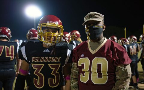 Staff Sgt. Gregory Cosby, Recruiting and Retention Battalion, meets with student athletes at a Riverdale High School football game Oct. 16, in Murfreesboro. Recruiters from the Tennessee National Guard make efforts to be involved in the community to build relationships with potential recruits. (Staff Sgt. Timothy Cordeiro, Tennessee National Guard Public Affairs Office)