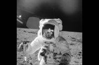 An astronaut on the Apollo 12 mission in November of 1969 gathers lunar soil, while another astronaut is reflected in his visor. Unable to risk astronauts getting sick so far from home, NASA and commercial partner Pillsbury came up with a system to eliminate hazards from the food production process. The food industry around the world has now adopted and built on that system. (NASA)
